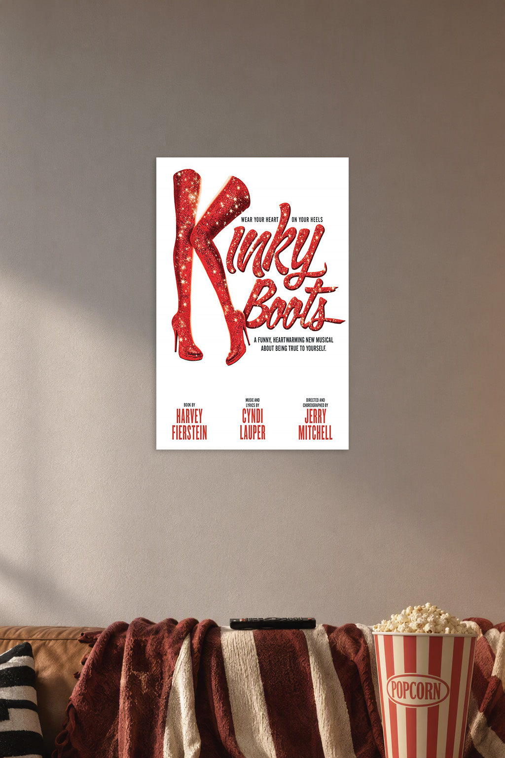 Kinky Boots Musical Red Boots in a cozy movie room above a brown sofa with popcorn.