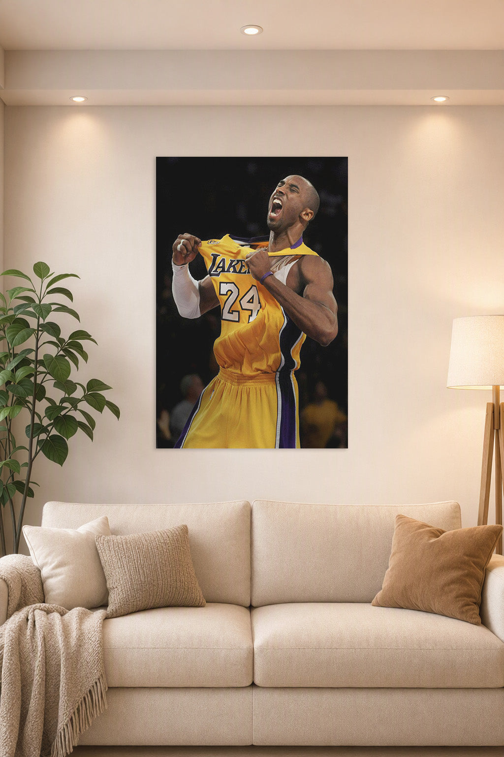 Kobe Bryant in a bright living room above a beige sofa.