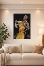 Kobe Bryant in a bright living room above a beige sofa.