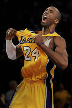 Kobe Bryant poster captures the basketball star shouting while pulling his yellow Lakers number 24 jersey on a dark court.