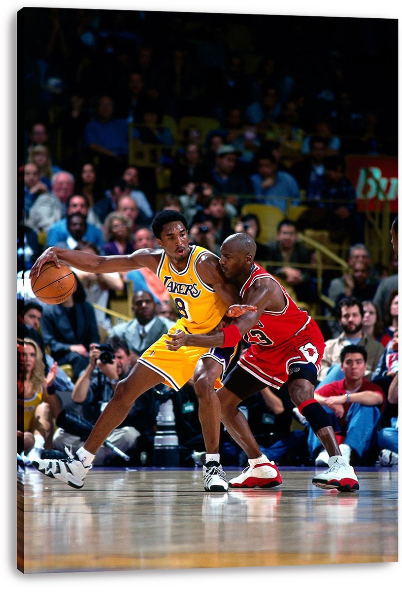 Kobe Bryant and Michael Jordan canvas wall art print features Bryant driving with the ball in yellow Lakers uniform while Jordan guards in red on the court.