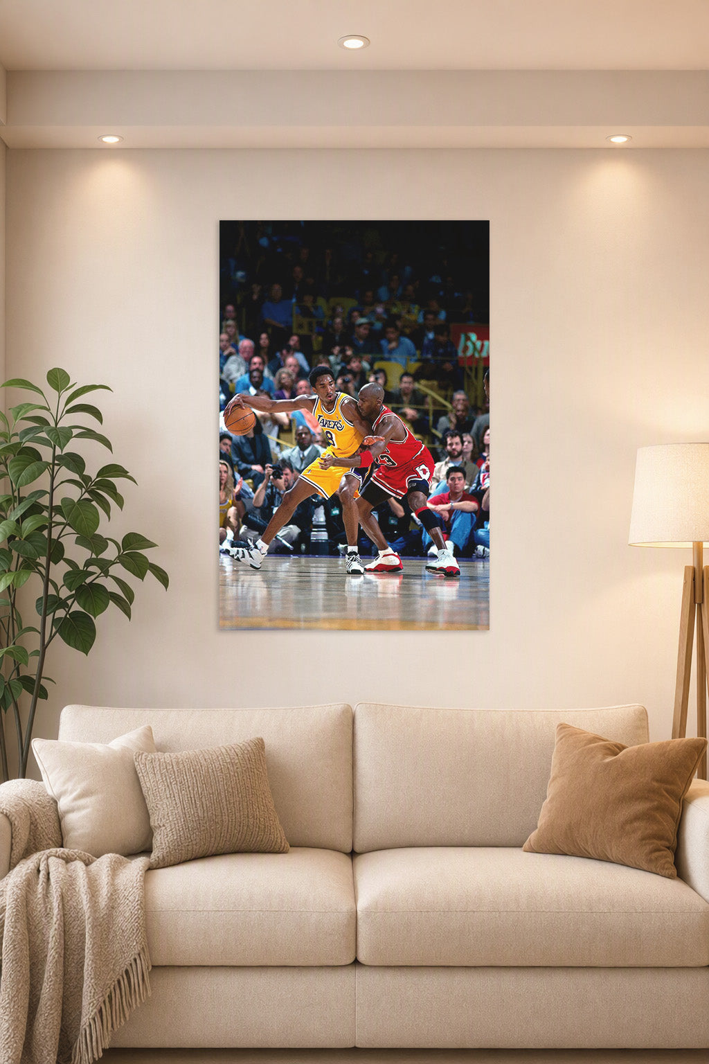 Kobe Bryant and Michael Jordan in a bright living room above a beige sofa.