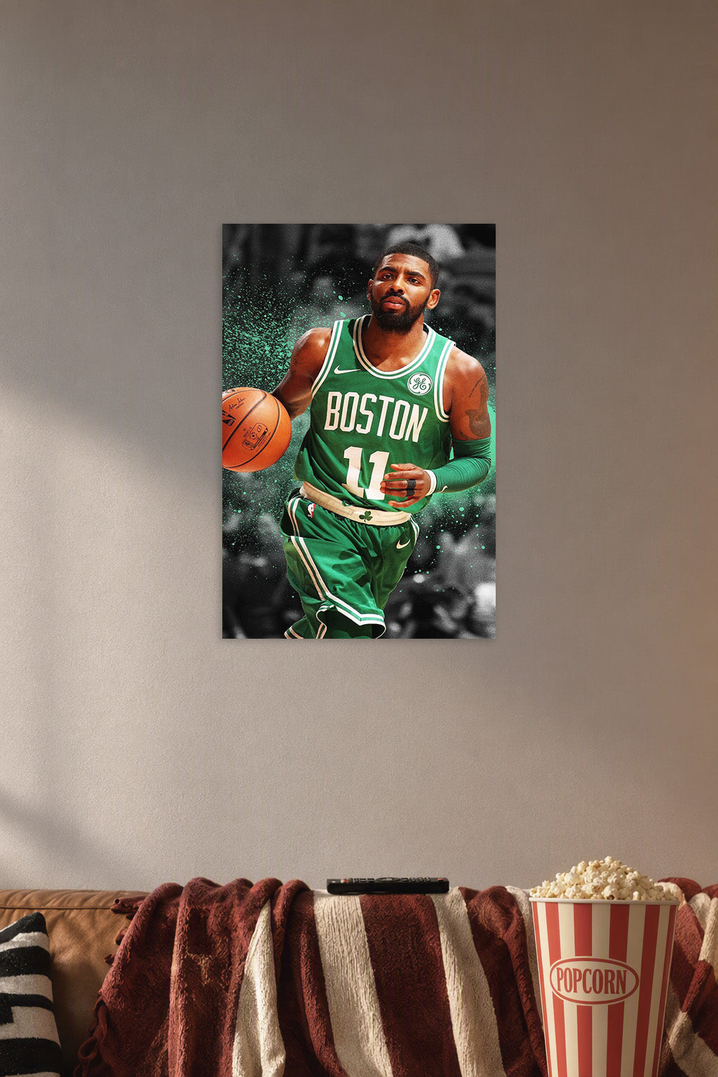 Kyrie Irving in a cozy movie room above a brown sofa with popcorn.