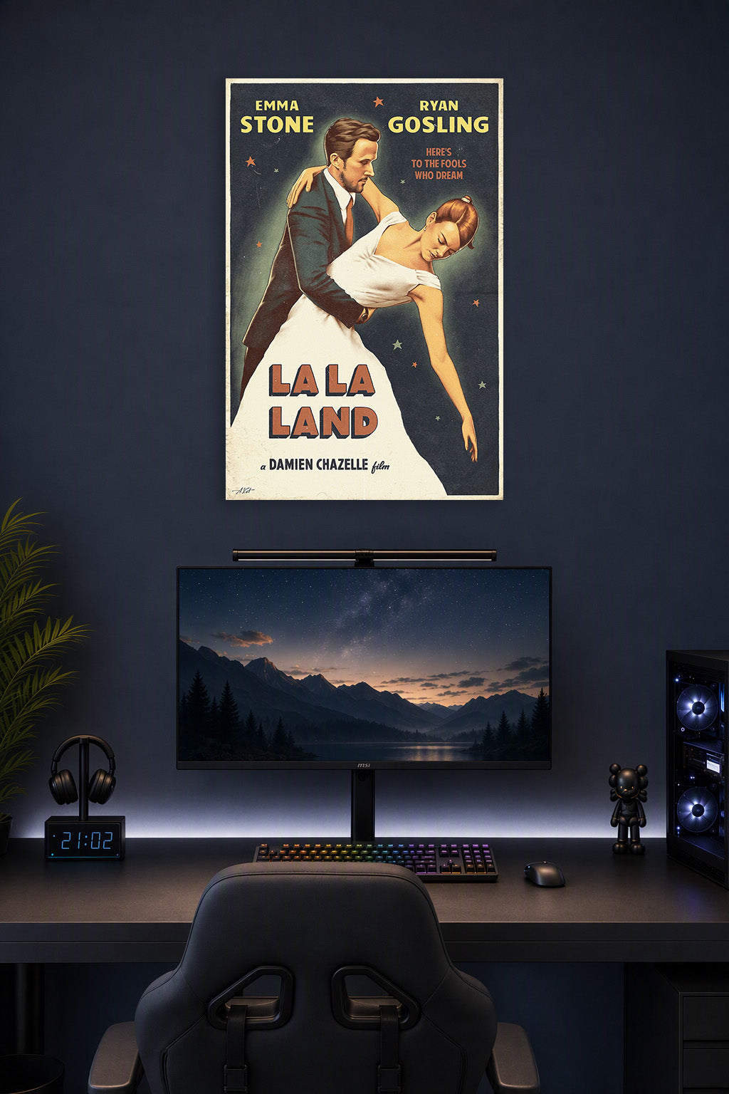 La La Land Emma Stone Ryan Gosling in a gaming desk setup above a monitor.