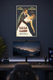 La La Land Emma Stone Ryan Gosling in a gaming desk setup above a monitor.