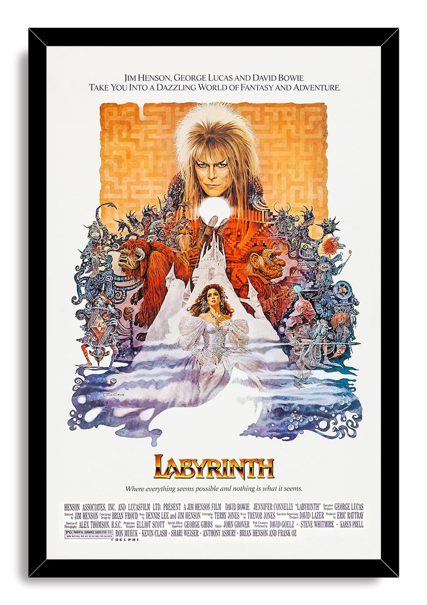 Labyrinth movie poster wall art print in a black frame, with Jareth, Sarah, goblins, a white castle, and orange labyrinth design.