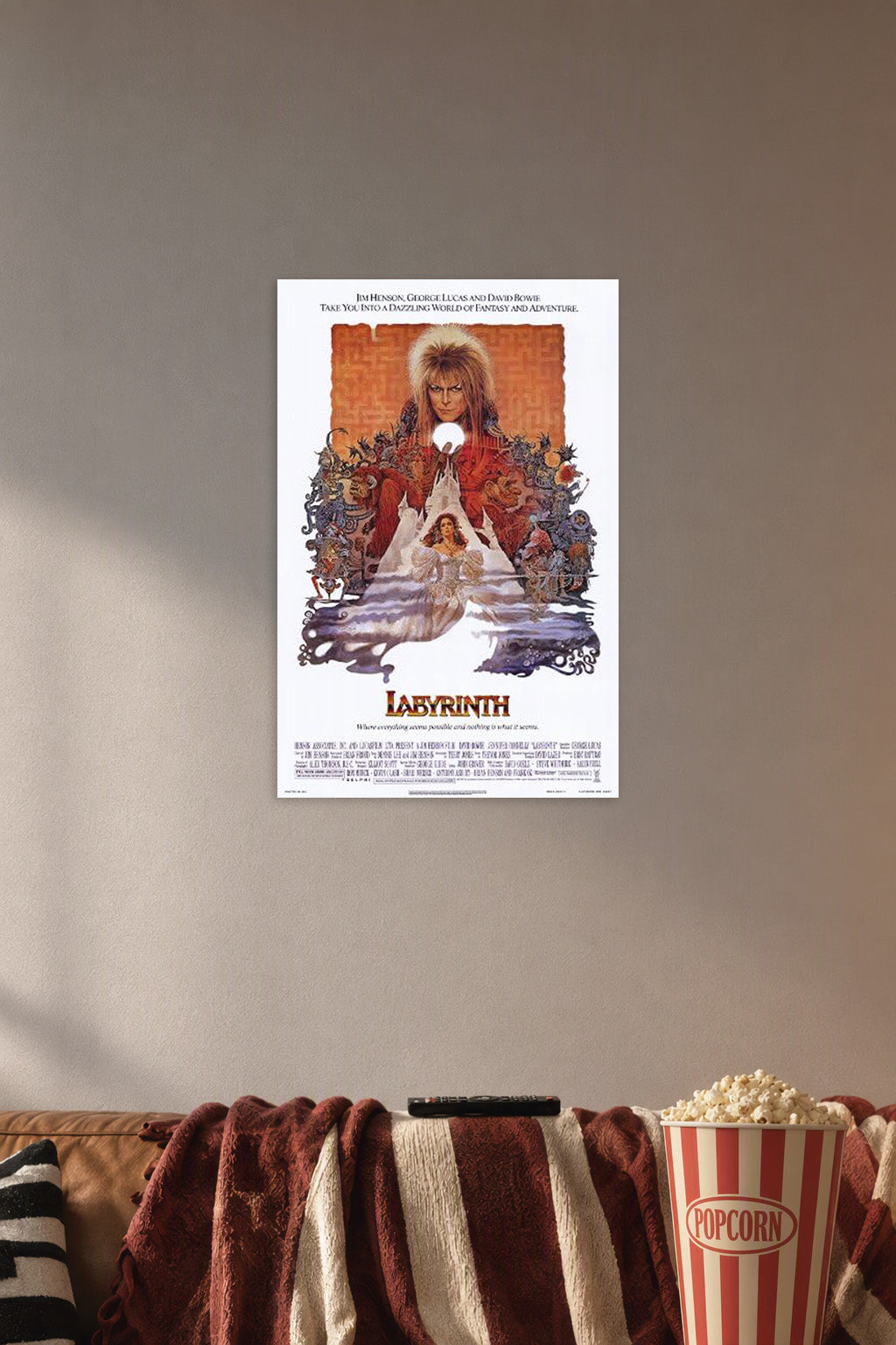 Labyrinth Movie in a cozy movie room above a brown sofa with popcorn.