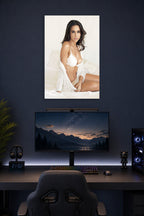 Lacey Chabert in a gaming desk setup above a monitor.