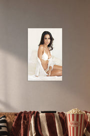 Lacey Chabert in a cozy movie room above a brown sofa with popcorn.