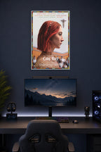 Lady Bird in a gaming desk setup above a monitor.