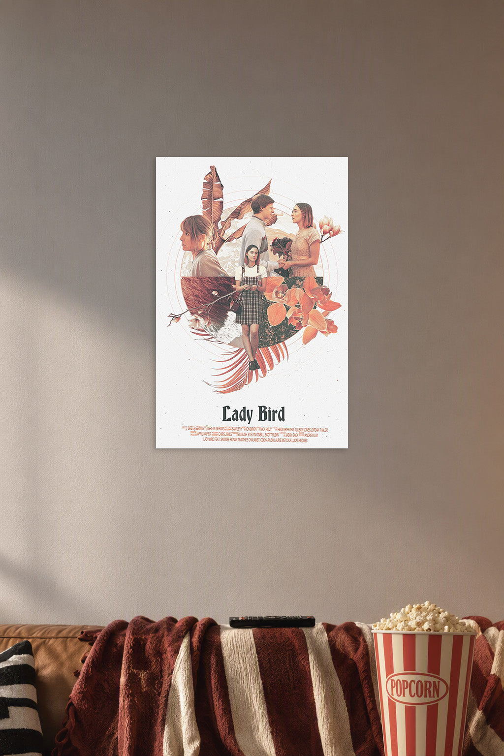 Lady Bird Movie in a cozy movie room above a brown sofa with popcorn.