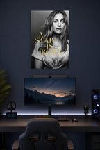 Lady Gaga A Star Is Born in a gaming desk setup above a monitor.