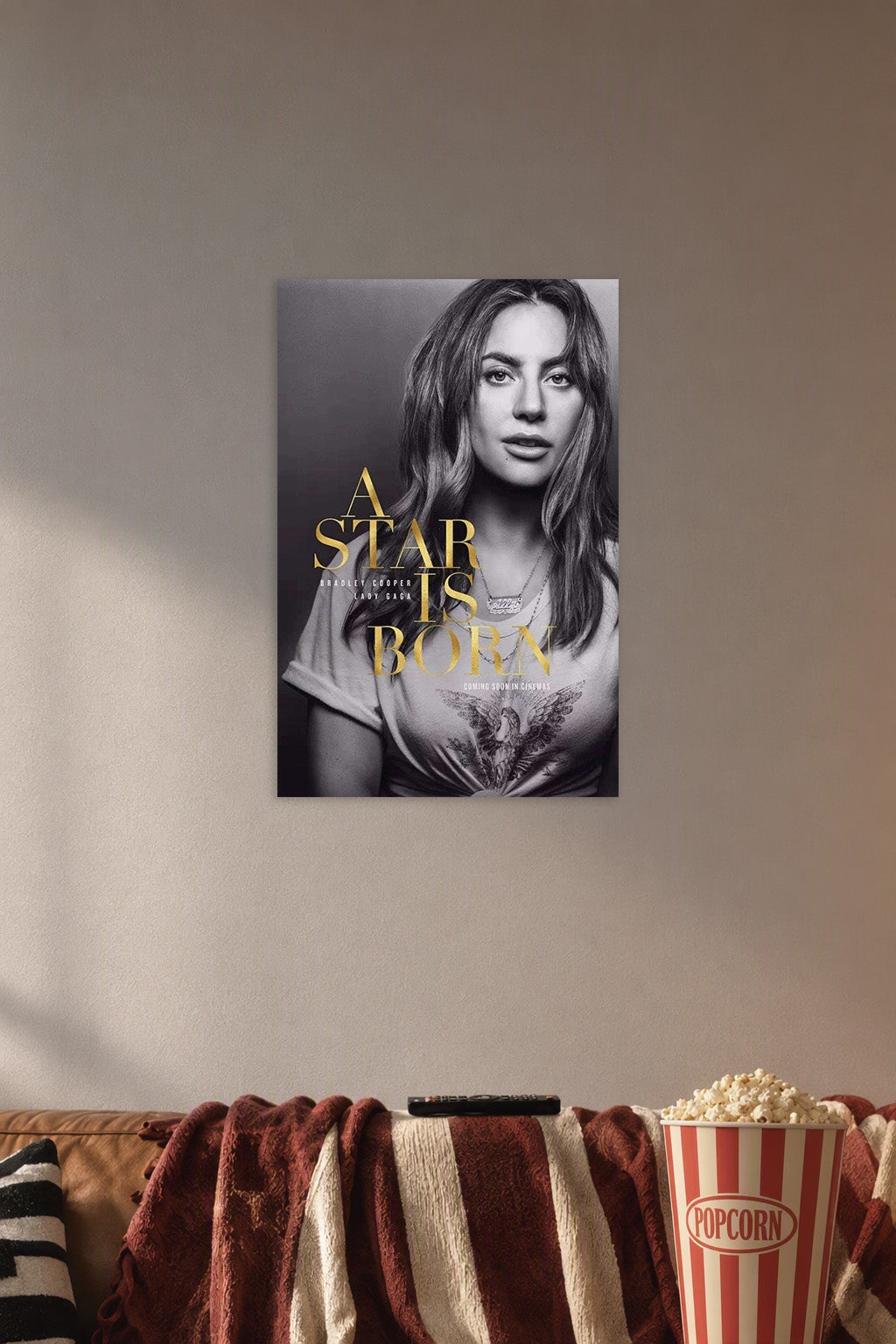 Lady Gaga A Star Is Born Movie in a cozy movie room above a brown sofa with popcorn.