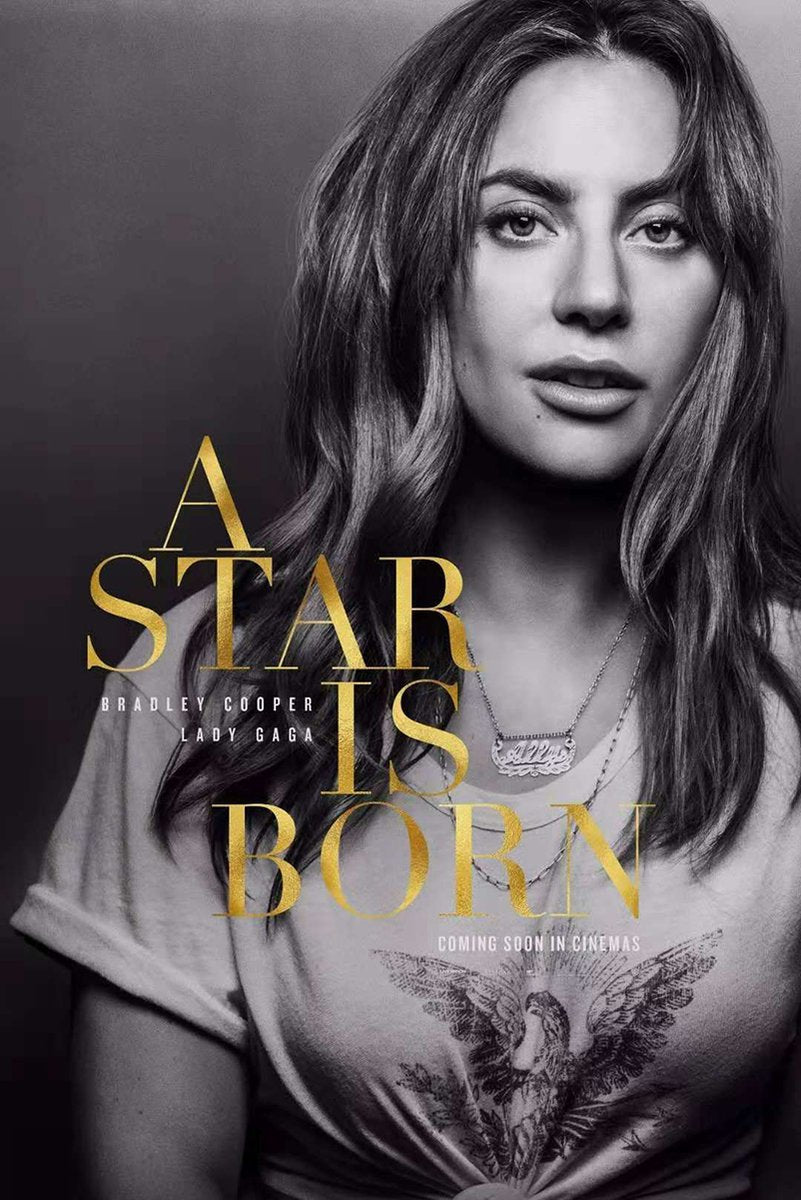 Lady Gaga A Star Is Born poster with a black-and-white close portrait, gold title lettering, necklaces, and eagle shirt graphic.