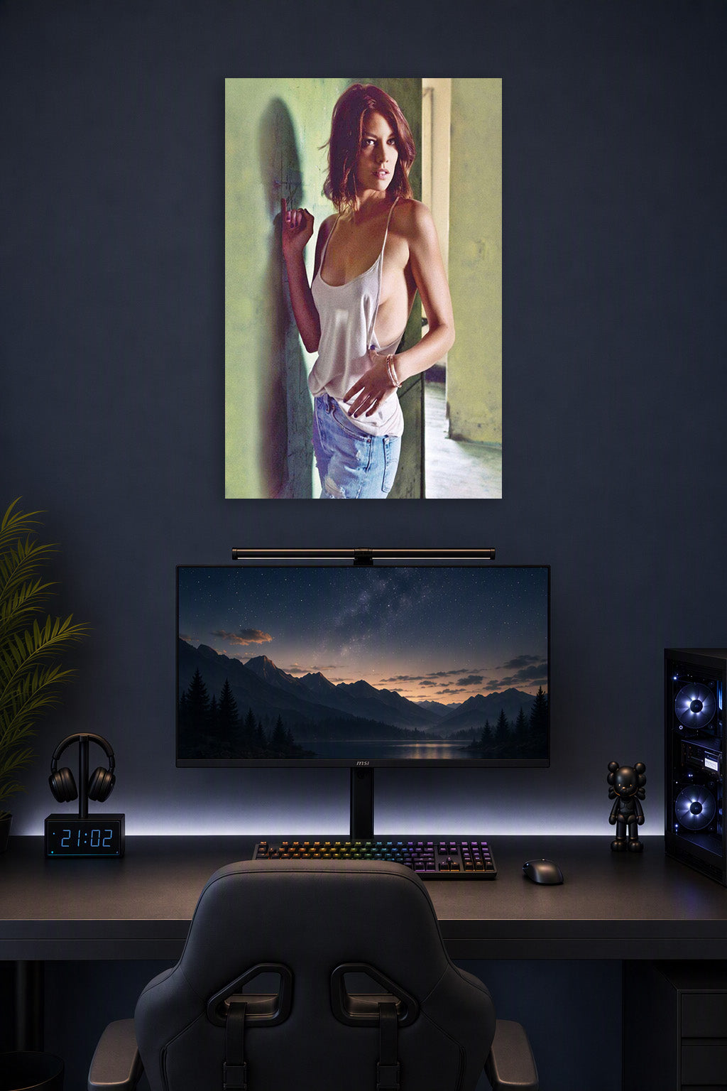 Lauren Cohan in a gaming desk setup above a monitor.