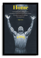 LeBron James framed wall art print in a black frame, with arms raised in a CAVS jersey under the yellow Home title.