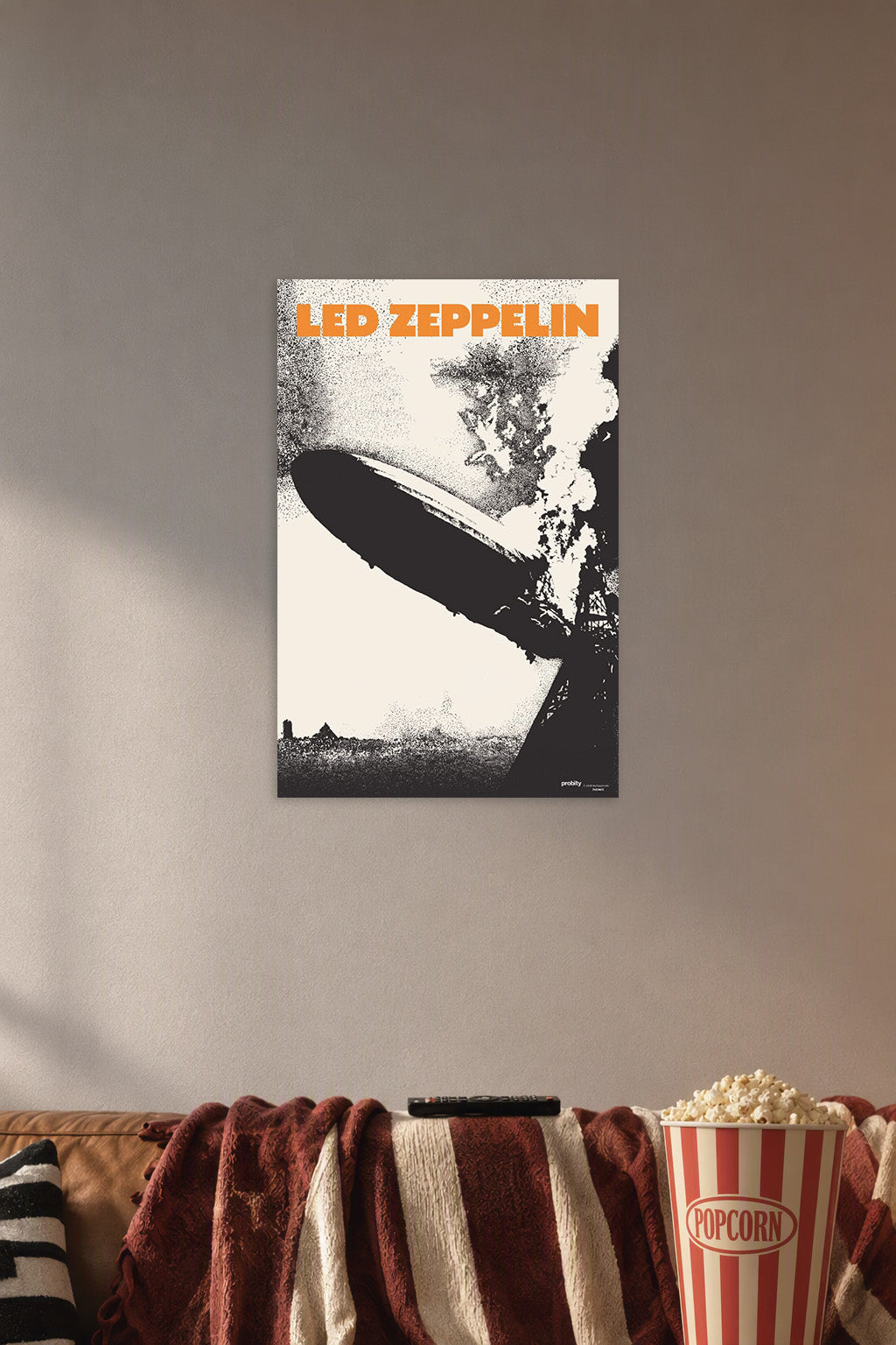 Led Zeppelin Music in a cozy movie room above a brown sofa with popcorn.