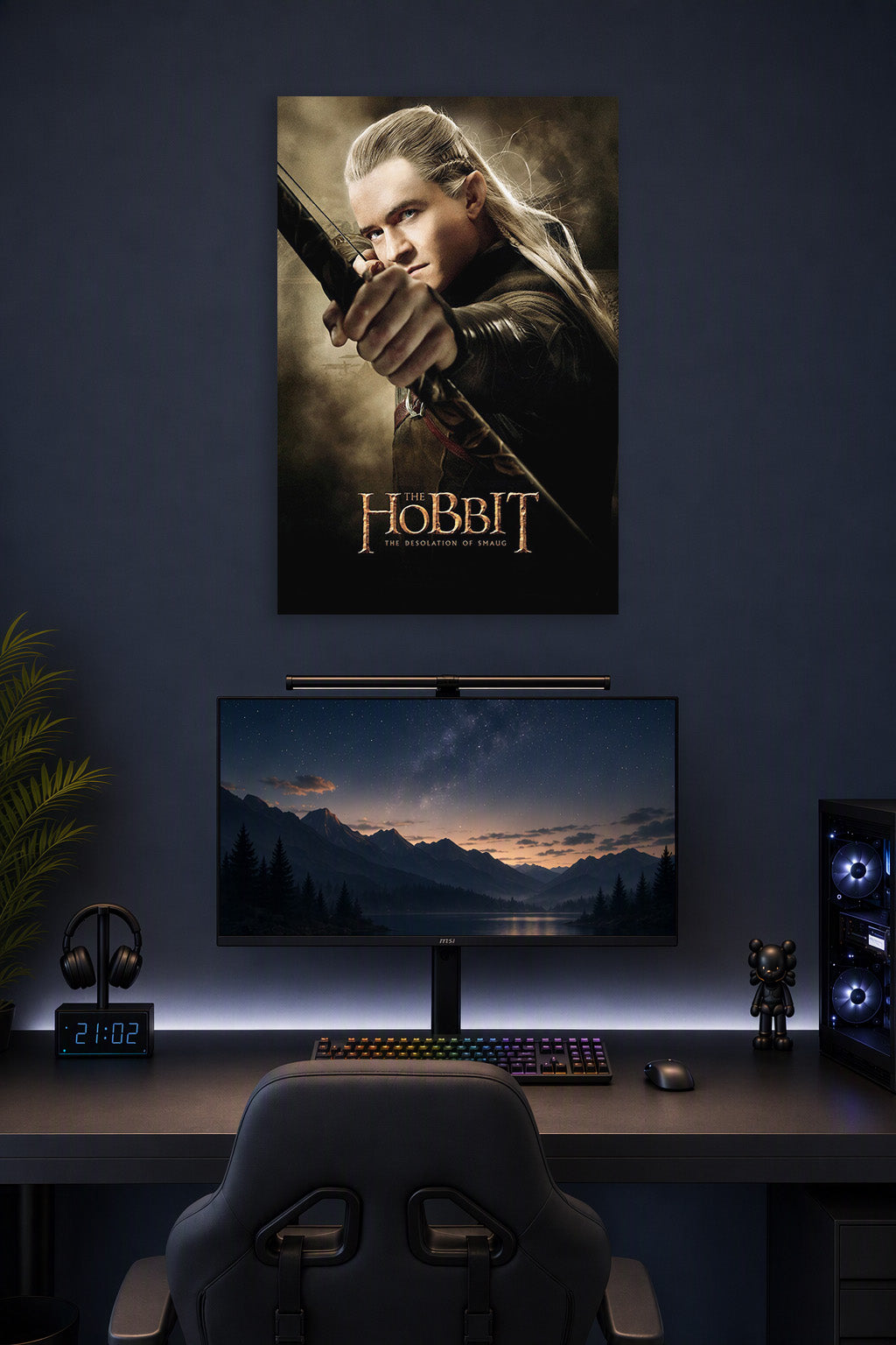 Legolas in a gaming desk setup above a monitor.