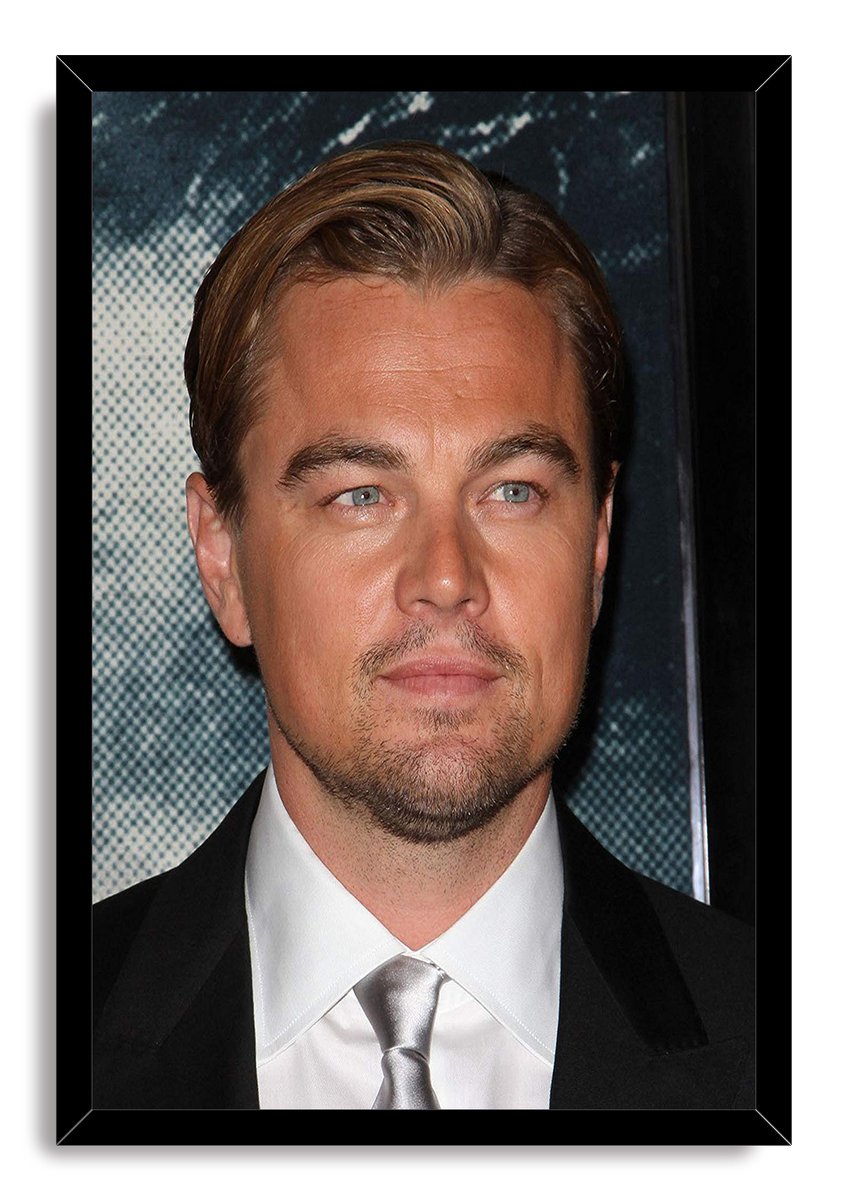 Leonardo DiCaprio framed wall art print featuring a formal close-up portrait, black suit, silver tie, and dark blue backdrop.