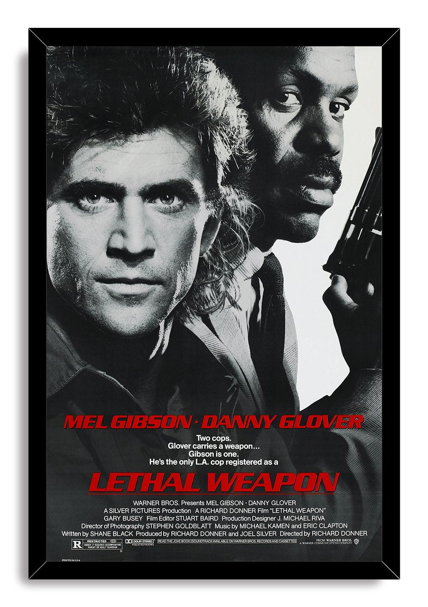 Lethal Weapon framed wall art print presents black-and-white portraits of Mel Gibson and Danny Glover with a handgun and red movie title.