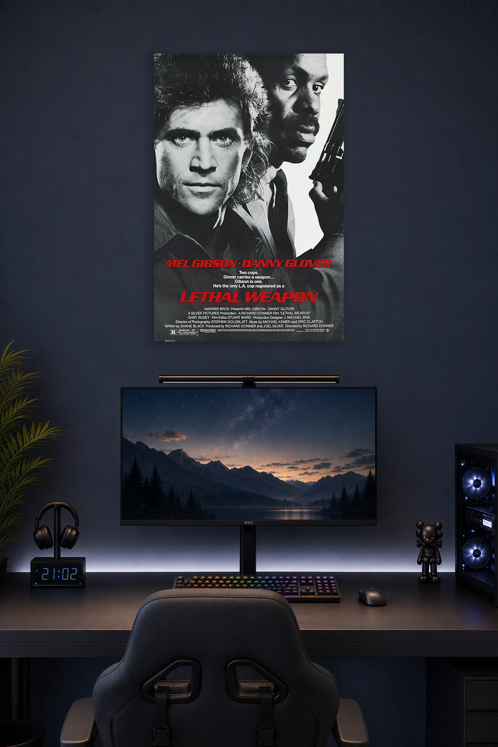 Lethal Weapon Mel Gibson Danny Glover in a gaming desk setup above a monitor.