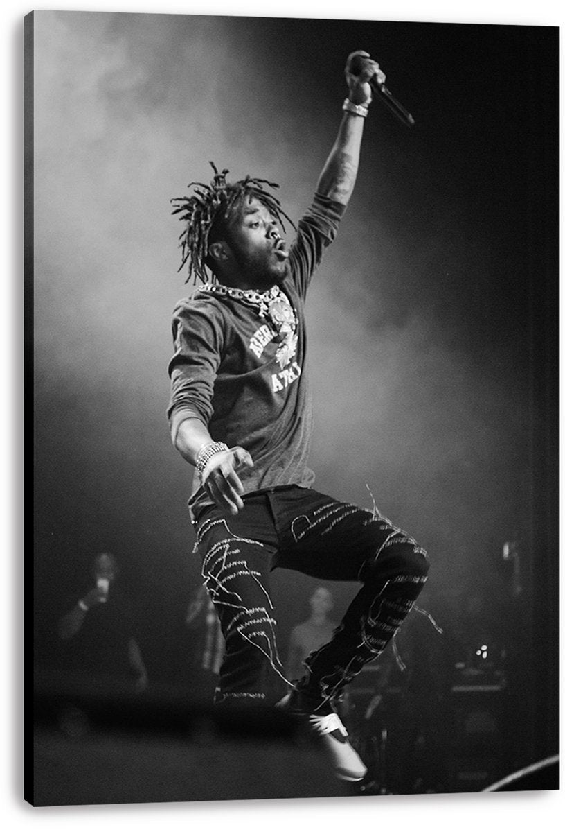 Lil Uzi Vert canvas wall art print displays a black-and-white concert scene of the rapper jumping with microphone raised.