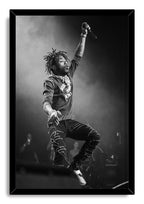 Lil Uzi Vert framed wall art print features a monochrome stage performance, with the rapper airborne and holding a microphone.