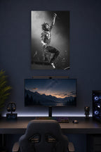 Lil Uzi Vert in a gaming desk setup above a monitor.