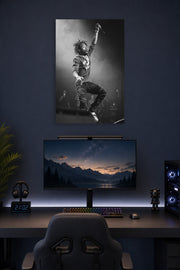 Lil Uzi Vert in a gaming desk setup above a monitor.