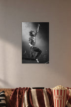 Lil Uzi Vert in a cozy movie room above a brown sofa with popcorn.