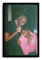 Lil Uzi Vert and Playboi Carti framed wall art print portrays the two artists looking downward against a dark background in a black frame.