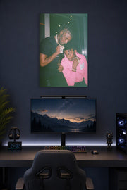 Lil Uzi Vert and Playboi Carti in a gaming desk setup above a monitor.