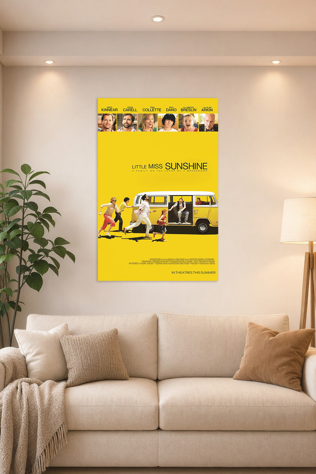 Little Miss Sunshine Movie Poster in a bright living room above a beige sofa.