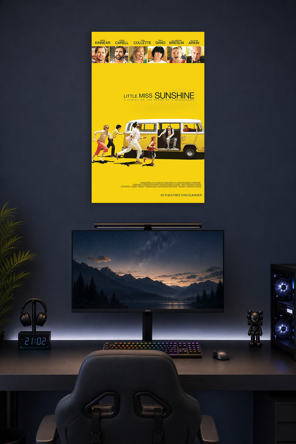Little Miss Sunshine Movie Poster in a gaming desk setup above a monitor.