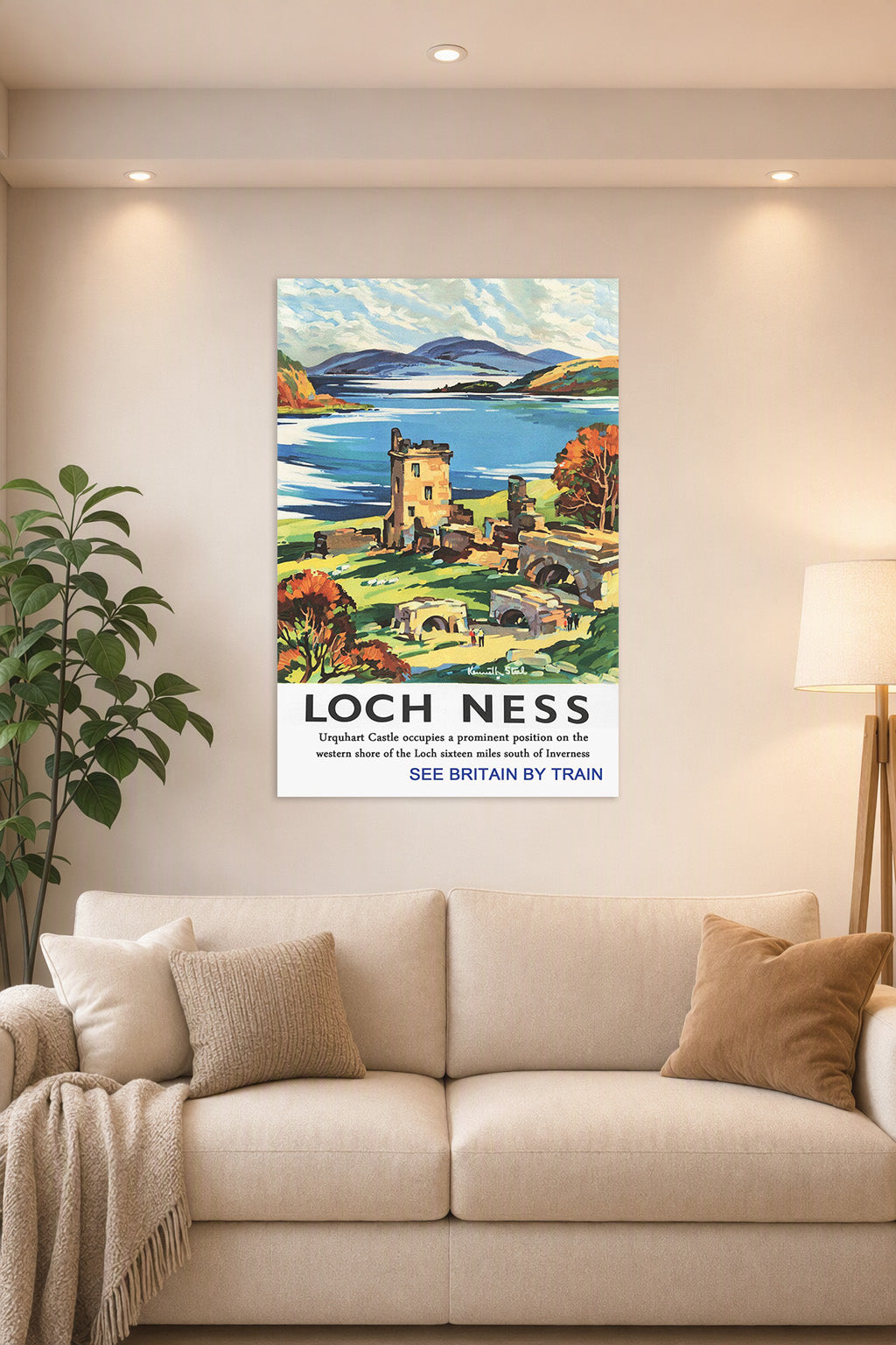 Loch Ness Urquhart Castle in a bright living room above a beige sofa.