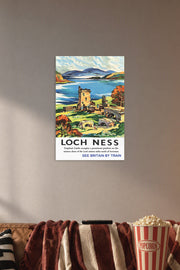 Loch Ness Urquhart Castle in a cozy movie room above a brown sofa with popcorn.