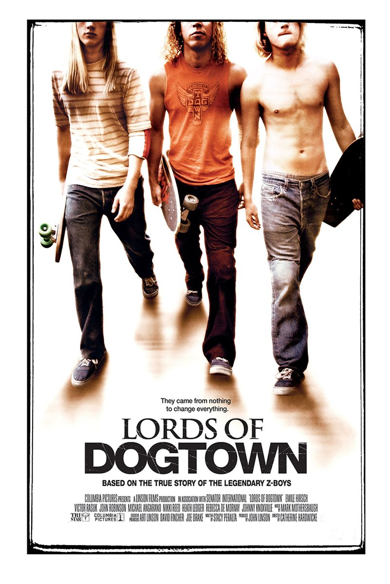Lords of Dogtown poster features three young skateboarders walking forward with boards against a warm white backdrop.