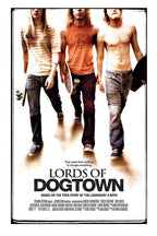 Lords of Dogtown poster features three young skateboarders walking forward with boards against a warm white backdrop.