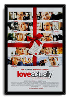 Love Actually framed wall art print with a black border, eight actor portraits, red present ribbon, bow, tag, and film title.