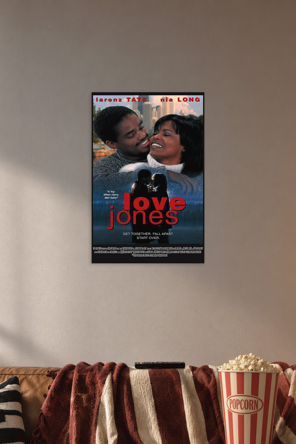 Love Jones Movie Poster in a cozy movie room above a brown sofa with popcorn.