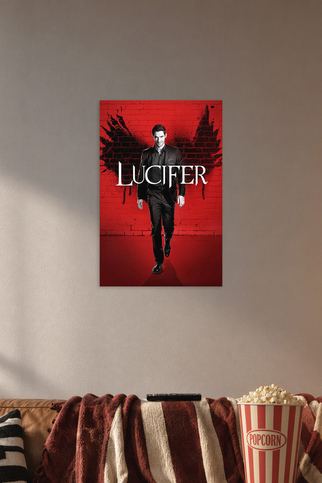 Lucifer Morningstar in a cozy movie room above a brown sofa with popcorn.