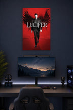 Lucifer Morningstar in a gaming desk setup above a monitor.