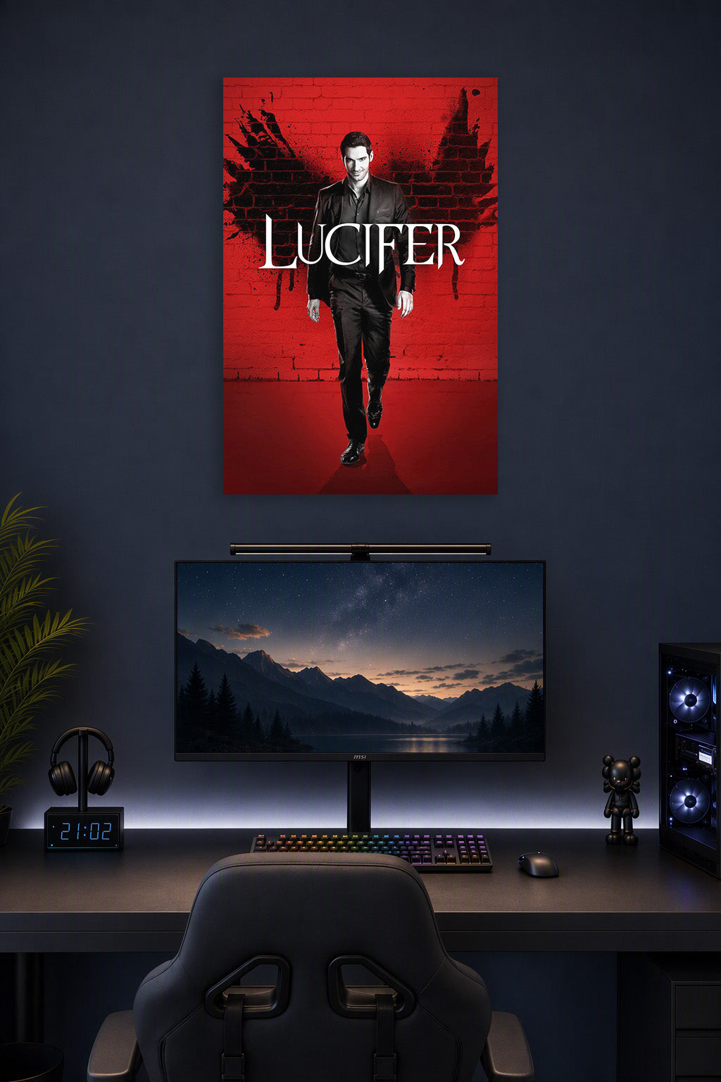Lucifer Morningstar in a gaming desk setup above a monitor.