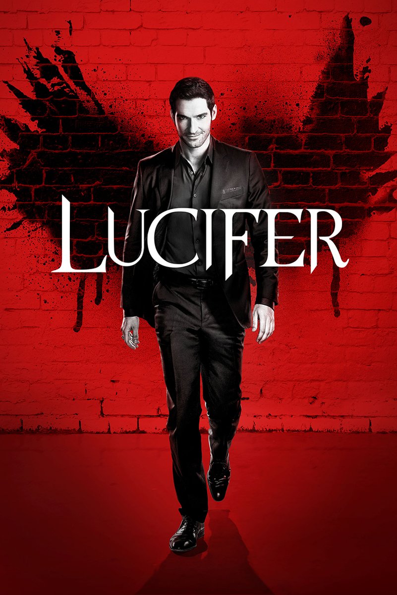 Lucifer Morningstar poster features a man in a black suit walking before a red brick wall with black wing-like graffiti and white Lucifer text.