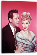 Lucille Ball and Desi Arnaz canvas wall art print, featuring the couple in formal attire against a vivid pink background.
