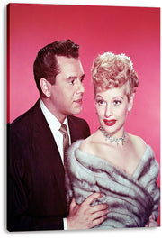 Lucille Ball and Desi Arnaz canvas wall art print, featuring the couple in formal attire against a vivid pink background.