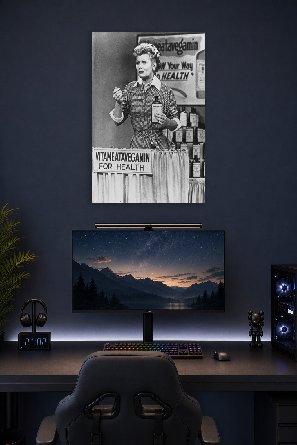 Lucille Ball I Love Lucy Vitameatavegamin in a gaming desk setup above a monitor.