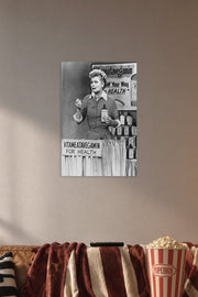 Lucille Ball I Love Lucy Vitameatavegamin in a cozy movie room above a brown sofa with popcorn.