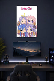 Lucky Star Anime Girls in a gaming desk setup above a monitor.