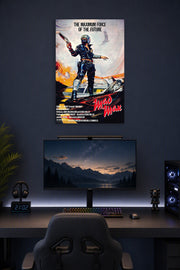 Mad Max in a gaming desk setup above a monitor.